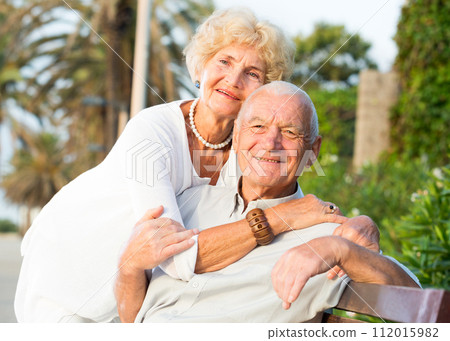smiling male and female hugging smiling male and female hugging 112015982