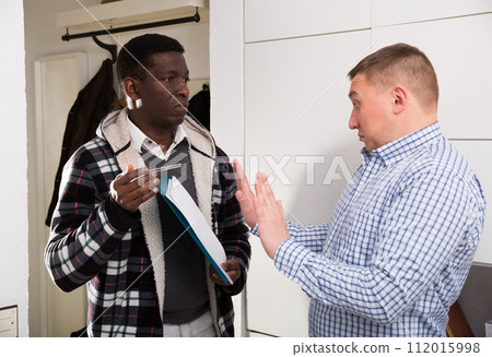 Two worried men with documents, having conflict about services Two worried men with documents, having conflict about services 112015998