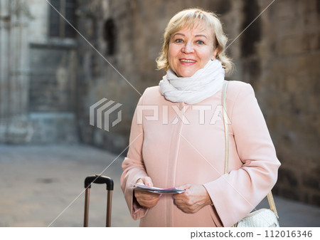 adult woman holding map guide adult woman holding map guide 112016346