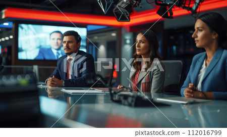 News Anchors Preparing for Live Broadcast News Anchors Preparing for Live Broadcast 112016799