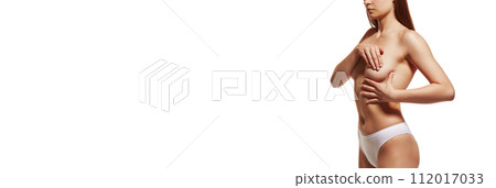 Female health care. Cropped image of young girl in underwear, covering breast with hands against white studio background 112017033