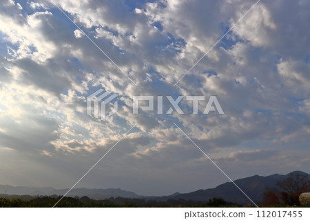 Cloudy morning sky, sunlight, mountains Cloudy morning sky, sunlight, mountains 112017455