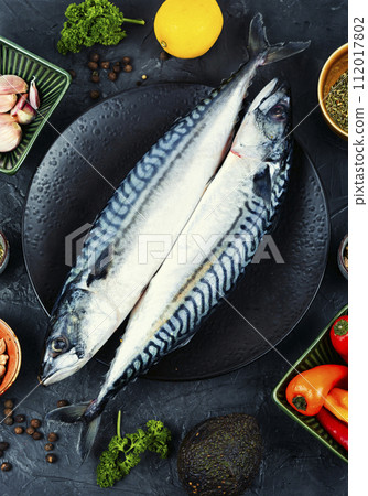 Fresh whole mackerel fish on the plate. 112017802