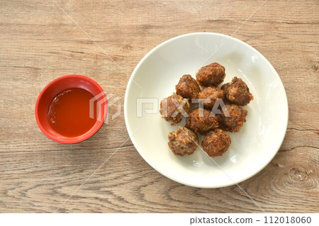 fried salt crispy chop pork with garlic dipping chili sauce on plate fried salt crispy chop pork with garlic dipping chili sauce on plate 112018060