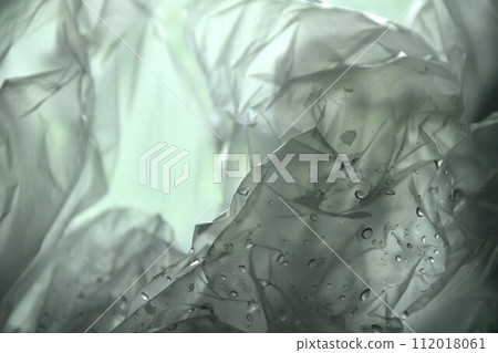 white plastic bag packing stacking with drop of water background and texture 112018061