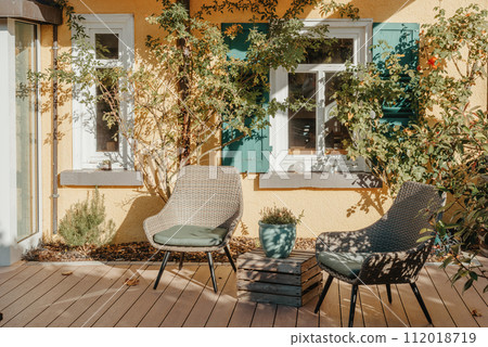 Garden Furniture For Leisure Time In Nature. Empty Chairs And Table Table In Orchard. Wooden Outdoor Furniture Set For Picnic In Autumn Garden. Cozy Interior Courtyard With Table And Chair In Village 112018719