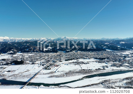 Drone photography: vast natural landscape of snow-covered countryside 112020708