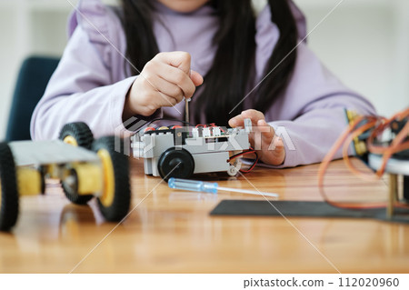 STEM education concept. Asian young girl learning robot design. STEM education concept. Asian young girl learning robot design. 112020960