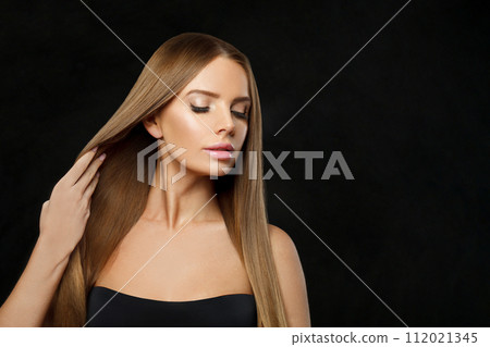 Gorgeous glamorous woman fashion model with long straight healthy hair and makeup posing Gorgeous glamorous woman fashion model with long straight healthy hair and makeup posing 112021345