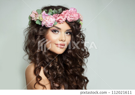 Beautiful fashion model woman with fresh skin, long dark wavy hair styling looking at camera Beautiful fashion model woman with fresh skin, long dark wavy hair styling looking at camera 112021611