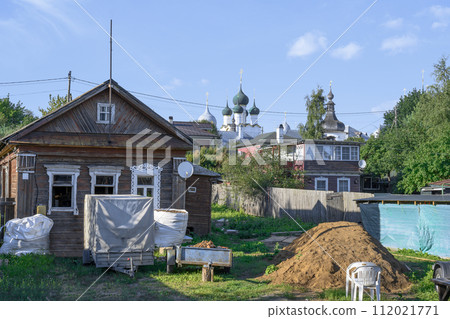 Repair of an old wooden house with white platbands Repair of an old wooden house with white platbands 112021771