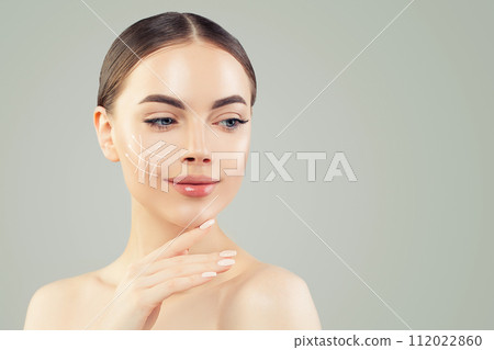 Charming woman. Face lift anti-aging lines on young female face. Charming woman. Face lift anti-aging lines on young female face. 112022860