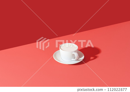 Cup of milk minimalist on a pink table 112022877