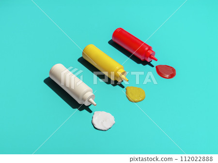 Sauce bottles above view, isolated on a blue background 112022888