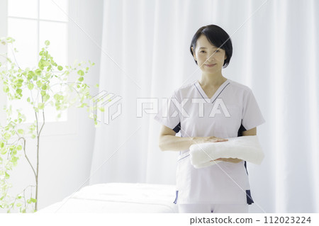 Portrait of a middle-aged female chiropractor Portrait of a middle-aged female chiropractor 112023224