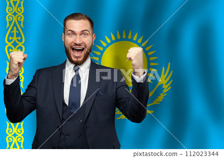 Kazakhstani happy businessman on the background of flag of Kazakhstan Business, education Kazakhstani happy businessman on the background of flag of Kazakhstan Business, education 112023344