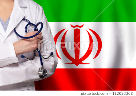 Irani medicine and healthcare concept. Doctor close up against flag of Iran background 112023368
