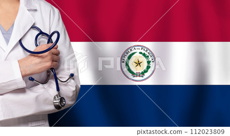 Paraguayan medicine and healthcare concept. Doctor close up against flag of Paraguayan background Paraguayan medicine and healthcare concept. Doctor close up against flag of Paraguayan background 112023809