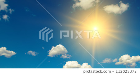 Bright sun on beautiful blue sky with white clouds. 112025372