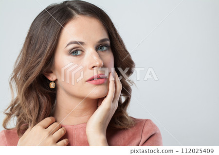 Pretty female face with natural clear skin  112025409