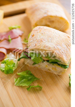 sandwich with sausage and herbs 112025736