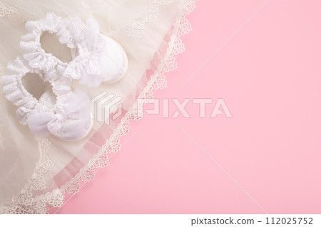 Christening background with baptism baby shoes on pink background 112025752