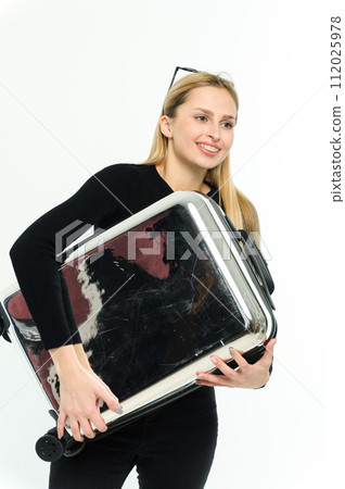 Pretty young woman with suitcase under her arm on white background. Pretty young woman with suitcase under her arm on white background. 112025978