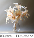 Beautiful transparent glass vase with standing on a gray background in the studio light. Transparent glass vase with big white flowers standing in the water. 112026872