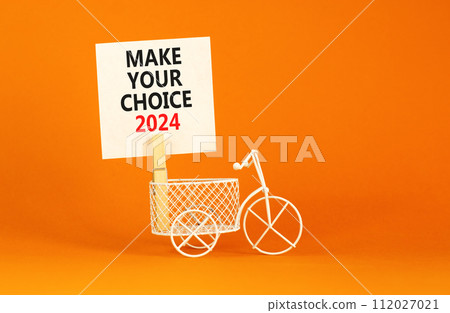 Make your choice 2024 symbol. Concept words Make your choice 2024 on beautiful white paper on clothespin. Bicycle model. Beautiful orange background. Business Make your choice 2024 concept. Copy space 112027021