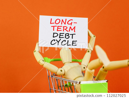 Long-term debt cycle symbol. Concept words Long-term debt cycle on beautiful white paper. Beautiful orange background. Businessman model. Business Long-term debt cycle concept. Copy space. 112027025