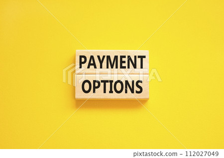 Payment options symbol. Concept words Payment options on beautiful wooden block. Beautiful yellow table yellow background. Business payment options concept. Copy space. Payment options symbol. Concept words Payment options on beautiful wooden block. Beautiful yellow table yellow background. Business payment options concept. Copy space. 112027049