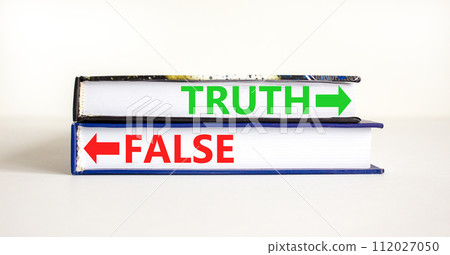 Truth or false symbol. Concept word Truth or False on beautiful books. Beautiful white table white background. Business and truth or false concept. Copy space. 112027050