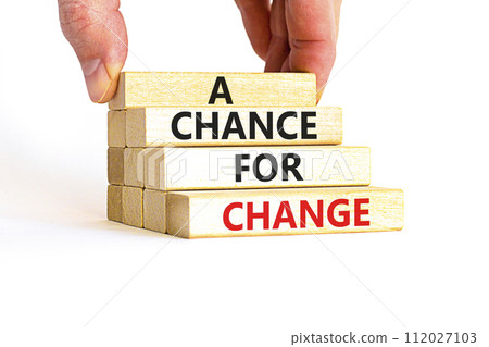A chance for change symbol. Concept words A chance for change on beautiful wooden block. Beautiful white table white background. Voter hand. Business A chance for change concept. Copy space. 112027103