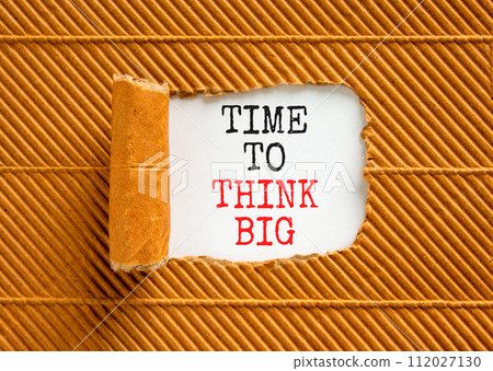 Time to think big symbol. Concept words Time to think big on beautiful white paper. Beautiful brown background. Business and time to think big concept. Copy space. Time to think big symbol. Concept words Time to think big on beautiful white paper. Beautiful brown background. Business and time to think big concept. Copy space. 112027130