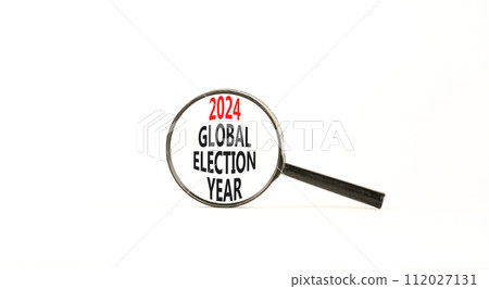 2024 global election year symbol. Concept words 2024 global election year on beautiful magnifying glass. Beautiful white table white background. Business 2024 global election year concept. Copy space 2024 global election year symbol. Concept words 2024 global election year on beautiful magnifying glass. Beautiful white table white background. Business 2024 global election year concept. Copy space 112027131