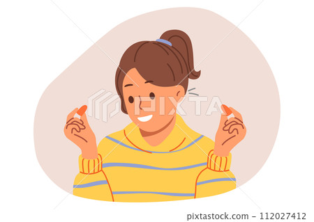 Woman uses earplugs to block out noise from neighbors so can concentrate or sleep Woman uses earplugs to block out noise from neighbors so can concentrate or sleep 112027412