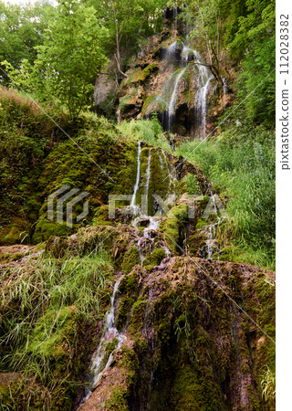 Waterfall Bad Urach at Southern Germany Longexposure. Cascade panorama in Bad Urach Germany is a popular natural attraction and waterfall sight called Uracher Wasserfall . Natural reserve in autumn 112028382