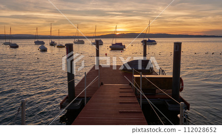 Bodensee Lake Sunset Panorama. Evening Sunlight Over Tranquil Waters. Sunset Vista at Lake Bodensee in Germany. 112028652