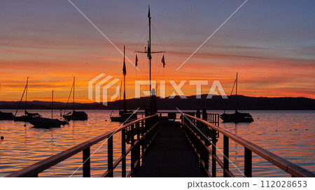 Bodensee Lake Sunrise Panorama. Morning Sunlight Over Tranquil Waters. 112028653