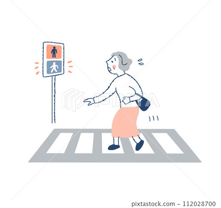 A senior woman who cannot cross a crosswalk with a green light 112028700