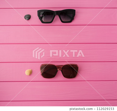 Summer abstract background mockup template sunglasses fashionable with seashells Summer abstract background mockup template sunglasses fashionable with seashells 112029153