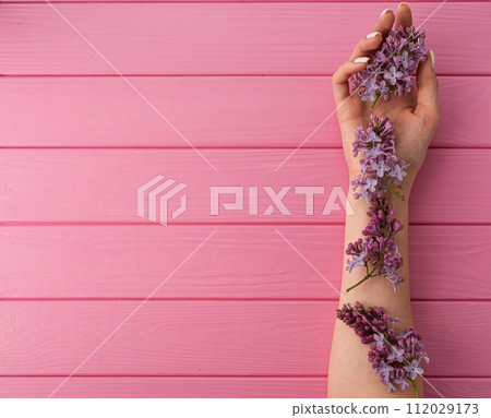 Summer abstract background mockup template woman hand manicure hold blossom flowers lilac Summer abstract background mockup template woman hand manicure hold blossom flowers lilac 112029173