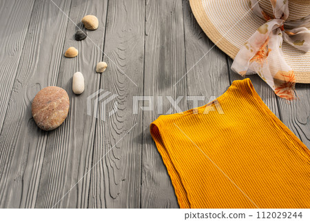 beachwear orange woman top outfit hat bag sun protection sunglasses pebbles. beachwear orange woman top outfit hat bag sun protection sunglasses pebbles. 112029244