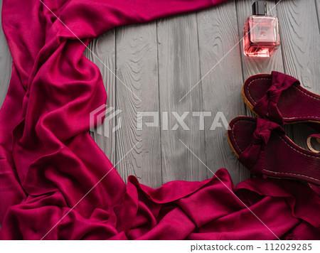 burgundy sandals wedge shawl shoes and bottle pink perfume. burgundy sandals wedge shawl shoes and bottle pink perfume. 112029285