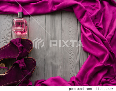 burgundy sandals wedge shawl shoes and bottle pink perfume. burgundy sandals wedge shawl shoes and bottle pink perfume. 112029286