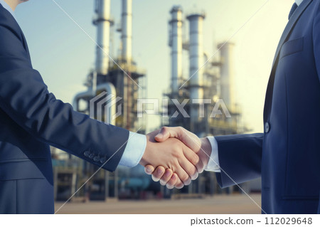 AI-generated content. Business Handshake in Front of Industrial Plant 112029648