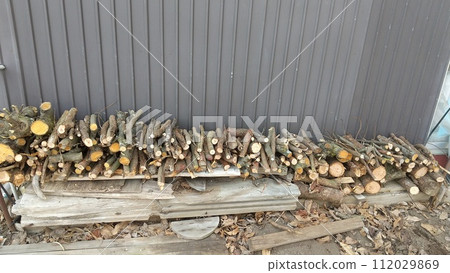 stack of thin firewood 112029869