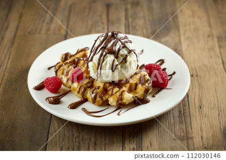 plate of belgian waffle with ice cream 112030146