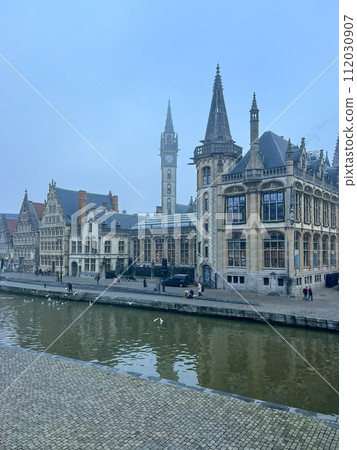 Ghent, Belgium. Old historic building near the river Leie on a foggy autumn day. 112030907
