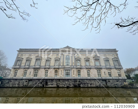 Ghent, Belgium The Palace of Justice, historic building reflecting in the canal 112030909